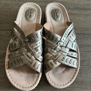 Gold woven crisscross Clark slip on sandals